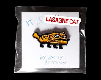 Orange Lasagne Cat enamel pin badge by Natty Peterkin – cute cat badges, Bag Pins Cat, Cat Idiot Pin, Cats Pin Badge, cursed cat, ugly cat