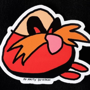 May include: A sticker featuring a cartoon character with a red body, orange mustache, and a pink nose. The character is outlined in black with a white border. The text "BY NATTY PETERKIN" is printed at the bottom.