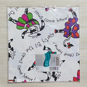 May include: White wrapping paper with a colorful cow design. The cows are wearing skirts and have the text "Party til the cows come home!" repeated on the paper. The paper is 8.5 square feet and comes in a pack of 2 sheets.