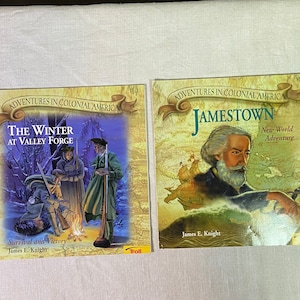 May include: Two paperback books about historical events in Colonial America. The book on the left is titled "The Winter at Valley Forge: Survival and Victory" and features a painting of three soldiers in a snowy forest. The book on the right is titled "Jamestown: New World Adventure" and features a painting of a man with a beard in a boat.