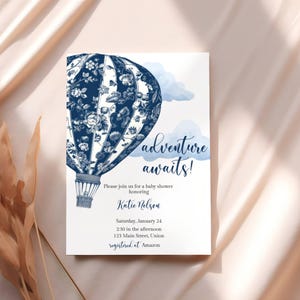 May include: A blue and white hot air balloon with floral patterns, a watercolour background, and the text "adventure awaits!" Please join us for a baby shower honouring Katie Nelson. Saturday, January 24, 2:30 in the afternoon, 123 Main Street, Union. Registered at Amazon.