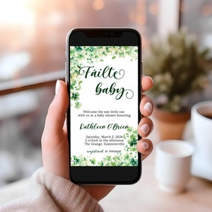 May include: A green and white baby shower invitation with shamrock designs and the text "Failte Baby" and "Welcome the wee little one with us at a baby shower honoring Kathleen O'Brien. Saturday, March 2, 2024, 2 o'clock in the afternoon, The Grange, Summerville, registered at Amazon."