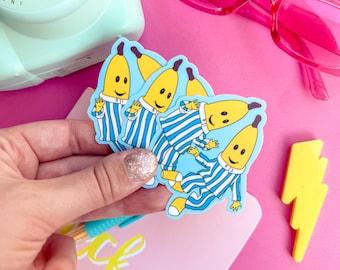Pegatina inspirada en Bananas in Pyjamas, resistente al agua e ilustrada digitalmente.
