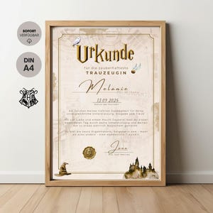 May include: A framed certificate with the text "Urkunde" in gold lettering, featuring a Hogwarts theme. The certificate includes the name "Melanie" and the date "13.09.2025". The frame is made of light brown wood.