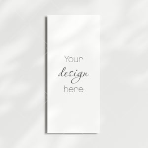 May include: A white card with the text "Your design here" written in black cursive.