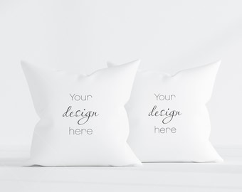 May include: Two white pillow covers with the text "Your design here" printed on them.