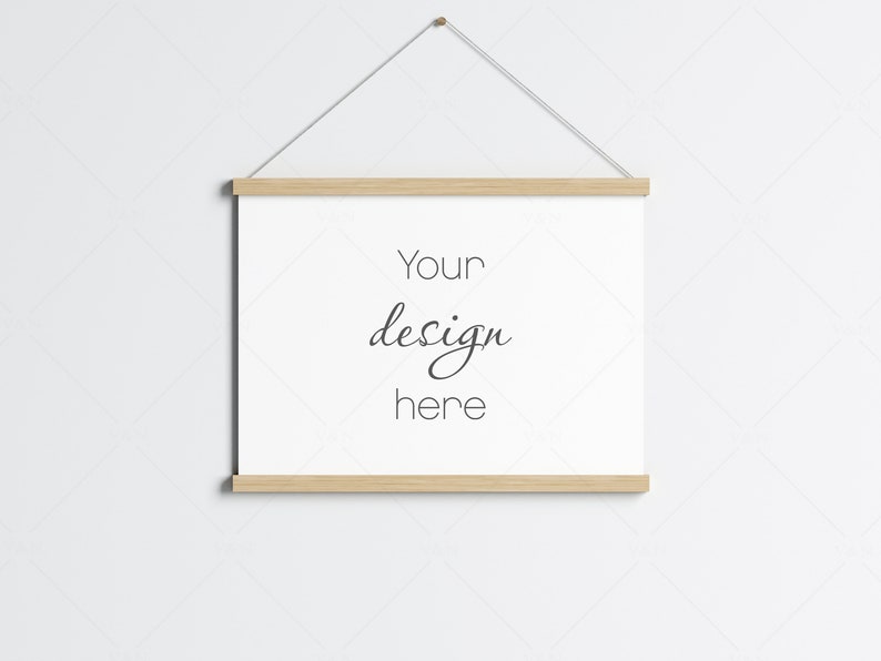 May include: A white canvas print with the text "Your design here" hanging on a white wall with a wooden frame.