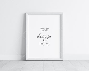 May include: A white picture frame with a white mat and a white background. The text "Your design here" is written in black cursive on the mat.