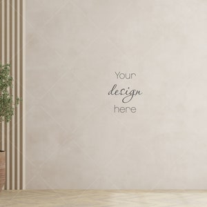 May include: A beige wall with wood panelling and a small potted plant in the corner. The text "Your design here" is written on the wall.