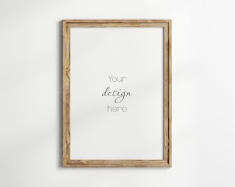 May include: A wooden picture frame with a white background and the text "Your design here" in black.