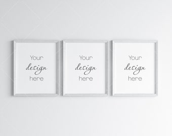 May include: Three white picture frames with a simple white mat and the text "Your design here" in each frame.