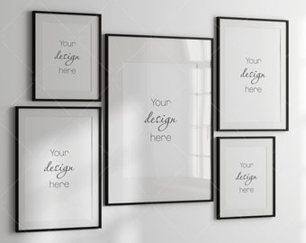 May include: A gallery wall mockup featuring six black framed art prints with white matting. Each frame has the text "Your design here" in a handwritten style font, perfect for showcasing artwork or photography.