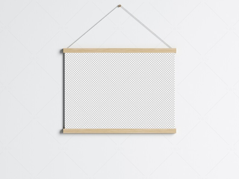 May include: A wooden frame with a blank canvas hanging on a white wall. The frame is attached to a string and has a simple, minimalist design.