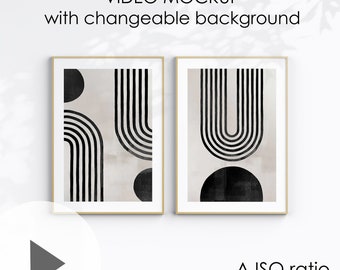 May include: Two framed black and white abstract art prints with a beige background. The prints feature geometric shapes and lines. The frames are a light wood color. The text "VIDEO MOCKUP with changeable background" is at the top of the image. The text "A ISO ratio (A1, A2, A3, A4)" is at the bottom of the image.