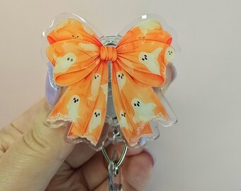 Orange Ghost Bow Badge Reel: Spooky Halloween Accessory