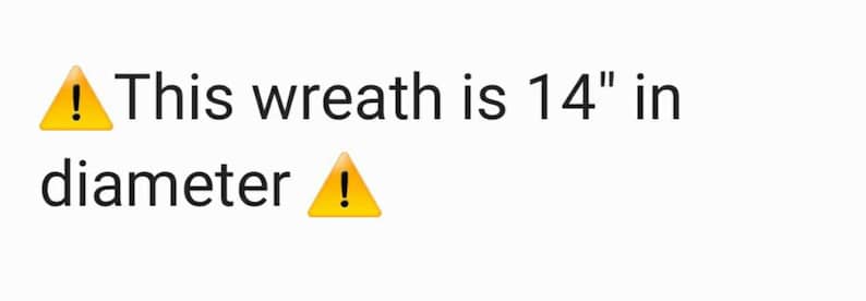 May include: Warning sign with an exclamation point. Text reads: This wreath is 14" in diameter.