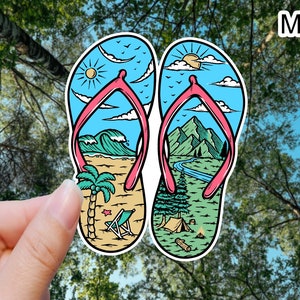 May include: Two colorful flip-flop sandals with a beach and mountain scene design. The sandals are blue, green, yellow, and white with pink straps. The text "M640" is in the upper right corner of the image.