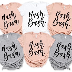 May include: Six t-shirts in different colors with the text "Nash Bash" printed in black cursive lettering.