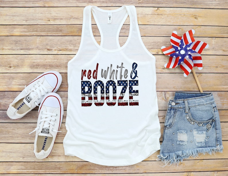 May include: White tank top with a red, white, and blue American flag design and the text "red white & booze".