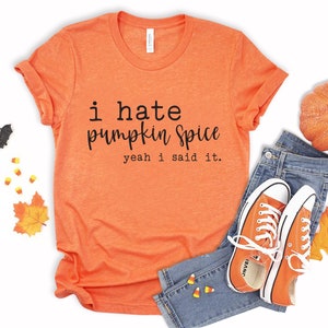 May include: Orange t-shirt with the text "i hate pumpkin spice yeah i said it."