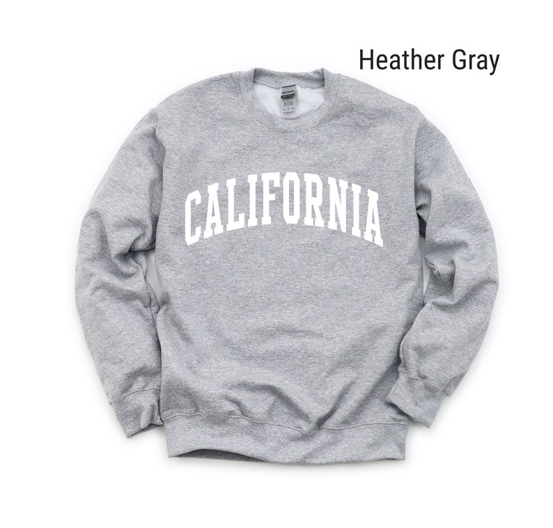 May include: Heather grey sweatshirt with the word "CALIFORNIA" printed in white on the front.