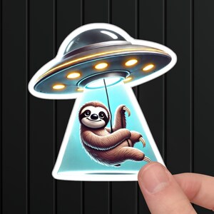 May include: A cartoon sloth hanging from a string attached to a flying saucer. The saucer is gray with a yellow rim and glowing lights. The sloth is brown with a light brown face and a happy expression.