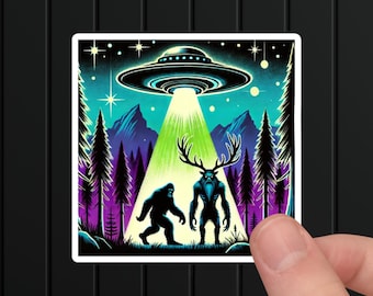 May include: A sticker featuring a black and blue illustration of Bigfoot and a creature with antlers, standing in a forest under a glowing green light from a flying saucer in the night sky.