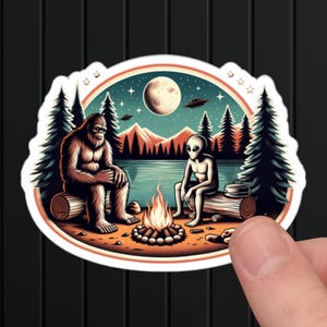 Bigfoot Alien Campfire Sticker: UFO Lake Design, Sasquatch Abduction