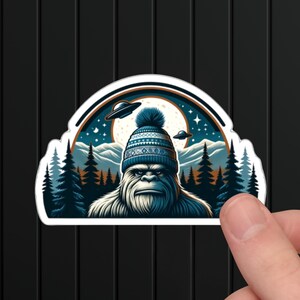 Winter Bigfoot UFO Sticker: Cozy Beanie Sasquatch Decal