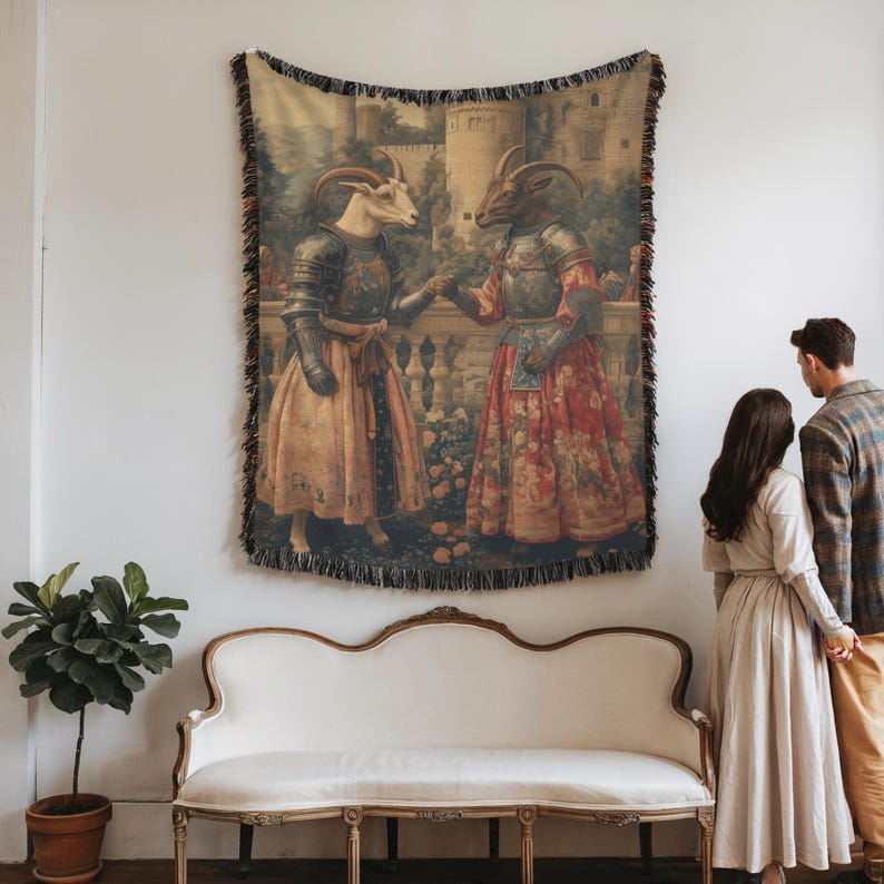 Woven blanket showing two goats in medieval armor and gowns on a castle terrace, surrounded by flowers and historical fantasy scenery