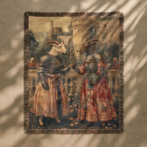 Woven blanket showing two goats in medieval armor and gowns on a castle terrace, surrounded by flowers and historical fantasy scenery