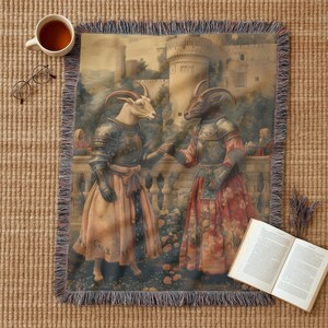 Woven blanket showing two goats in medieval armor and gowns on a castle terrace, surrounded by flowers and historical fantasy scenery