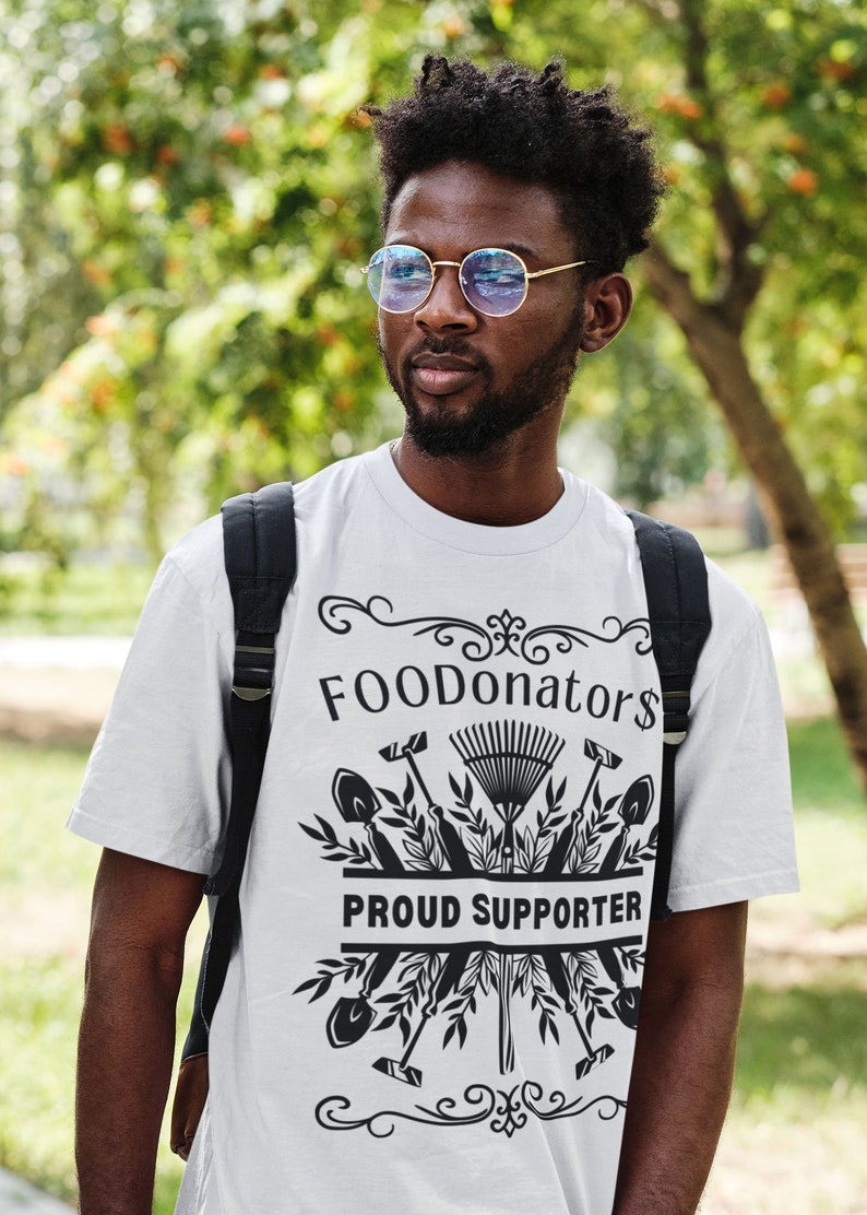 White and black plant lover shirt saying FOODonator$ proud supporter.