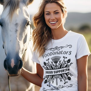 White and black gardening shirt saying FOODonator$ proud supporter.