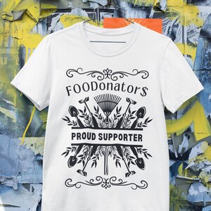 White and black plant mom shirt saying FOODonator$ proud supporter.