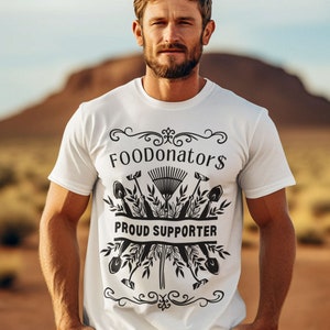 White and black vegan shirt saying FOODonator$ proud supporter.