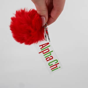 Alpha Chi Omega Schwesternschaft Schlüsselanhänger / ACHIO benutzerdefinierte Farbe griechische Schlüsselanhänger mit Pom Pom / große kleine Schwester Geschenk