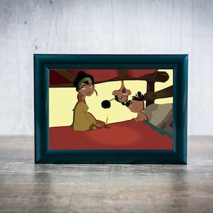 May include: A framed illustration of three cartoon characters. A woman with dark hair and a green headband sits on a red bed. Two other characters are upside down, peeking out from under the bed. The scene is set in a room with a yellow wall and a wooden bed frame.