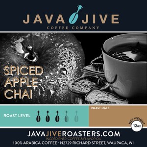 May include: A black and white image of a coffee product. The text "SPICED APPLE CHAI" is displayed over a close-up of an apple with water droplets. A cup of chai and dried fruit slices are also visible. The label indicates a 12oz net weight.