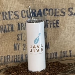 May include: White stainless steel tumbler with a blue and white logo that says "Java Jive Coffee Company". The tumbler is sitting on a bed of coffee beans.