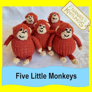 May include: Five knitted red monkeys with black eyes and beige faces. The monkeys are sitting on a white surface. The text "Five Little Monkeys" is on a blue banner below the monkeys. The text "Nana's Knitlings" is on a white tag with a floral design.
