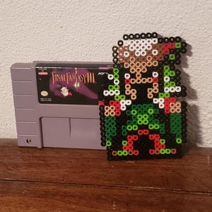 Kefka z Final Fantasy 6 (karta SNES nie jest dołączona)
