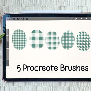 May include: A digital tablet displays five egg-shaped designs with various patterns, including gingham and houndstooth, in shades of green and white. The text "5 Procreate Brushes" is displayed below the designs. A stylus rests on top of the tablet.