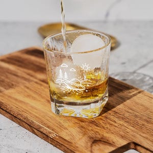 UFO Crash Site Whiskey Glass – Alien Spaceship Wreckage Scene with Trees, Smoke, and Debris – Sci-Fi Whiskey Tumbler Gift