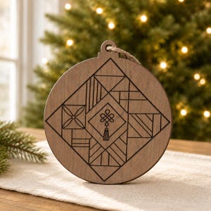 May include: A round, wooden Christmas ornament with a geometric design. The ornament is brown with a carved square pattern in the center, featuring various shapes and a tassel. A jute string is attached for hanging.