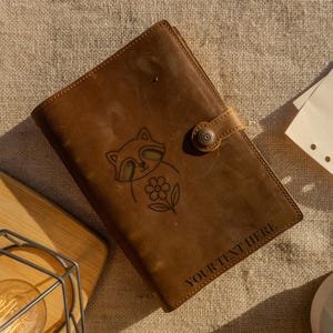 Genuine Leather Journal with Raccoon and Flower Design – Handcrafted Animal and Nature Themed Writing Notebook