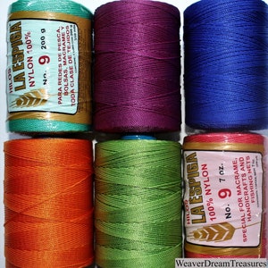May include: Six spools of La Espiga 100% nylon thread in various colors: teal, purple, blue, orange, green, and red. Each spool has a label with the brand name, thread type, size, and suggested uses.