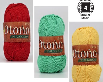 May include: Three balls of yarn in red, green, and yellow. The yarn is labeled "Otoño De Algodon Mercerizado" and is a medium weight yarn.