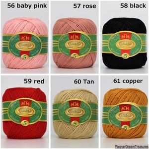 May include: Six balls of yarn in different colors, including baby pink, rose, black, red, tan, and copper. Each ball has a label that says "Crochet Omega" and shows the yarn is 100% cotton.