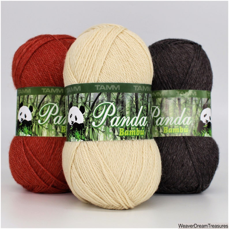 May include: Three skeins of Panda Bamboo yarn in red, cream, and brown. The yarn is labeled "Panda Bamboo" with a panda bear logo.